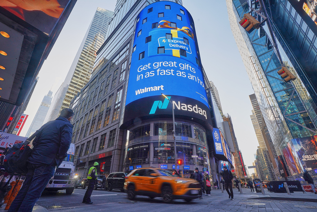 Walmart is displayed on the facade of the Nasdaq MarketSite, in New York, Tuesday, Dec. 9, 2025. (AP Photo/Richard Drew)