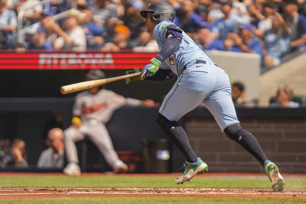 Toronto Blue Jays' George Springer watches his RBI double during third-inning baseball game action against the Baltimore Orioles in Toronto, Sunday, Sept. 14, 2025. (Chris Young/The Canadian Press via AP)