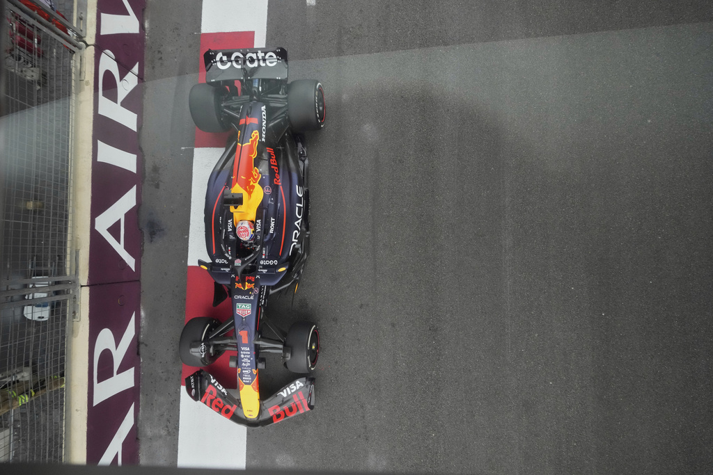 Red Bull driver Max Verstappen of the Netherlands shot in action through a glass during the Azerbaijan Formula One Grand Prix in Baku, Azerbaijan, Sunday, Sept. 21, 2025. (AP Photo/Darko Bandic)