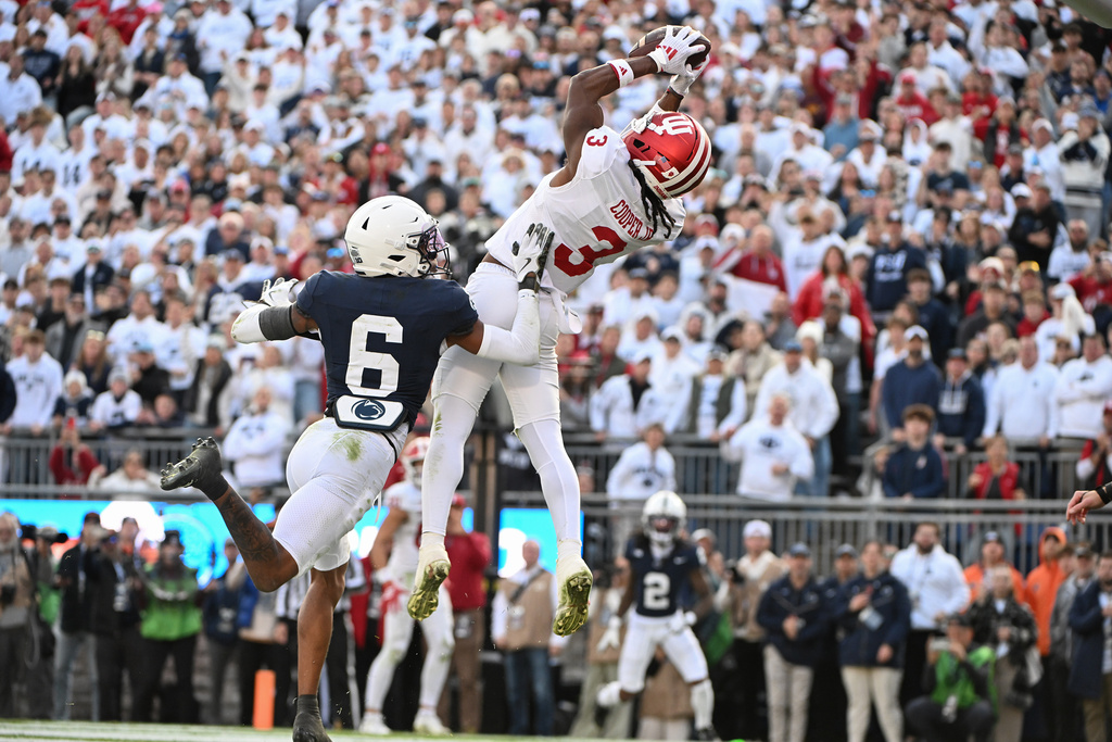 Indiana wide receiver Omar Cooper Jr. (3) catches a touchdown pass over Penn State safety Zakee Wheatley (6) during the fourth quarter of an NCAA college football game, Saturday, Nov. 8, 2025, in State College, Pa. (AP Photo/Barry Reeger)