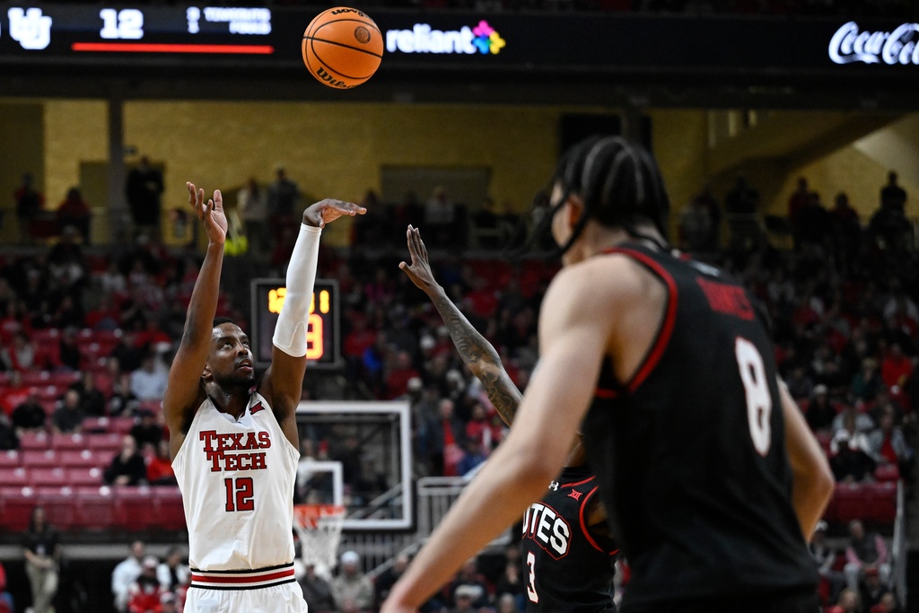 Texas Tech forward Donovan Atwell (12) shoots the ball against Utah during the first half of an NCAA college basketball game Wednesday, Jan. 14, 2026, in Lubbock, Texas. (AP Photo/Justin Rex)