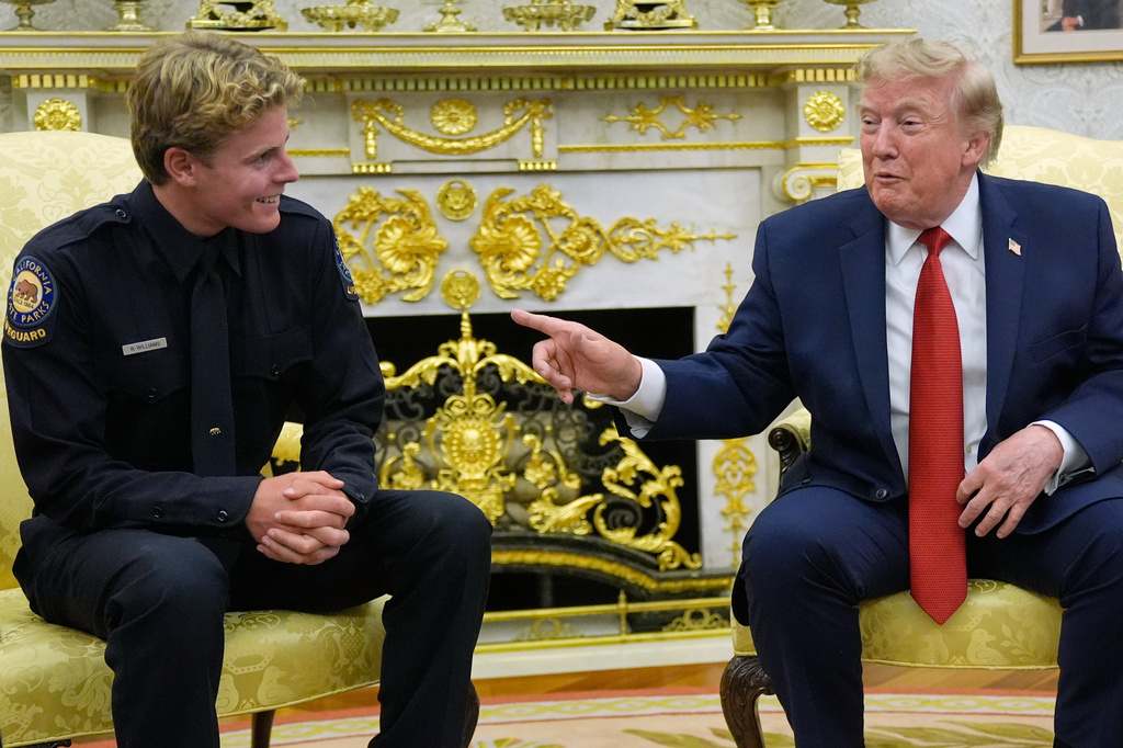 President Donald Trump speaks as he meets with lifeguard Ryder Williams in the Oval Office of the White House, Monday, Aug. 17, 2026, in Washington. (AP Photo/Manuel Balce Ceneta)