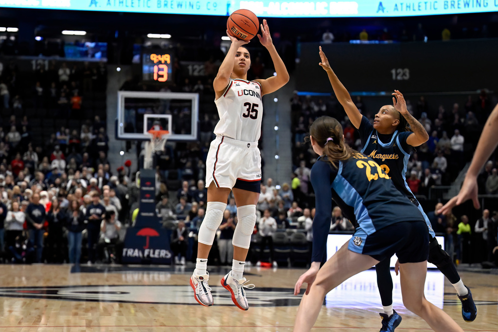 UConn guard Azzi Fudd (35) shoots in the first half of an NCAA college basketball game against Marquette, Wednesday, Dec. 17, 2025, in Hartford, Conn. (AP Photo/Jessica Hill)