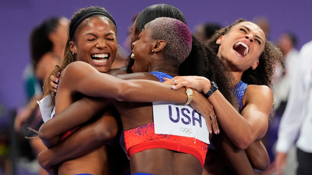 FILE - The United States' women 4x400-meter relay team celebrates winning the gold medal at the 2024 Summer Olympics, Aug. 10, 2024, in Saint-Denis, France. (AP Photo/Matthias Schrader, File)