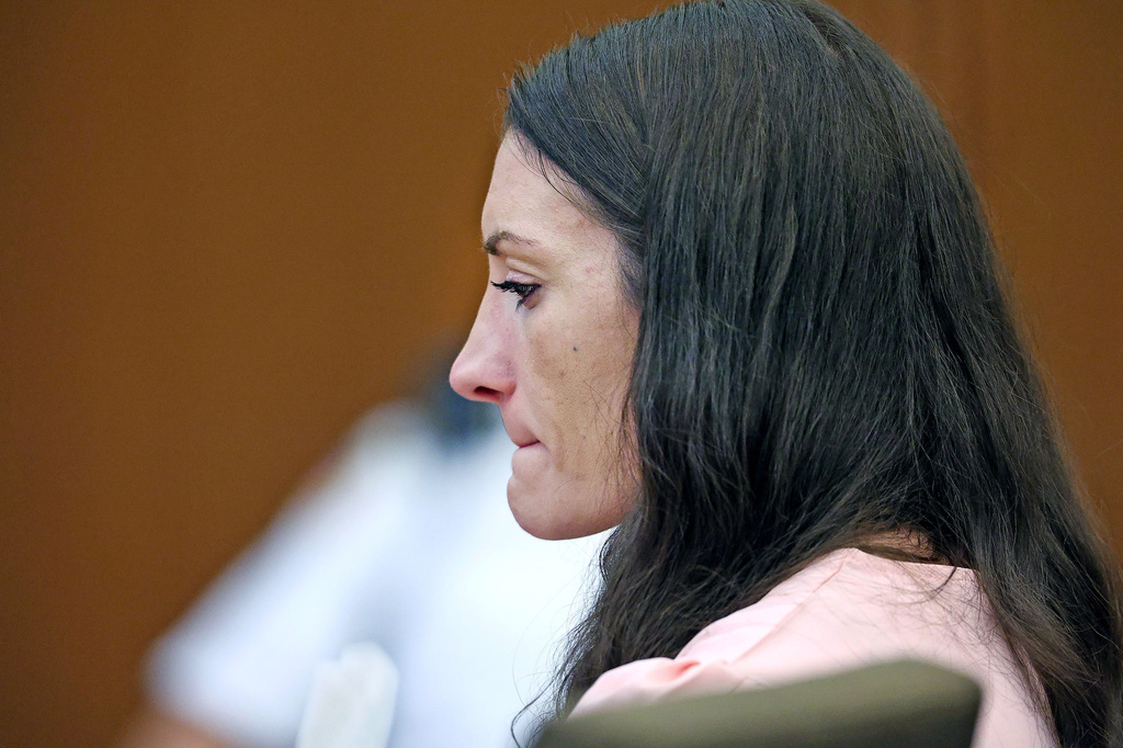 Defendant Lindsay Clancy listens to Dr. Jennifer Tufts on the witness stand during her murder trial at Plymouth Superior Court in Plymouth, Mass., Monday, Aug. 10, 2026. (Greg Derr/The Patriot Ledger via AP, Pool)