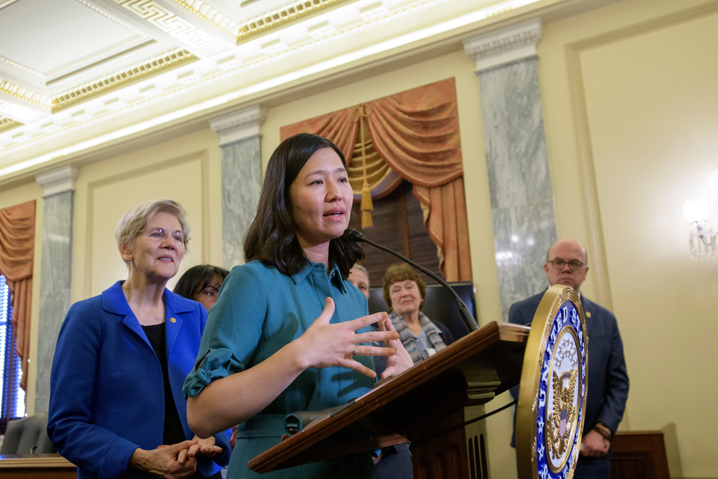 FILE - Boston Mayor Michelle Wu, right, is joined by Sen. Elizabeth Warren, D-Mass., left, as she speaks during a Massachusetts Congressional Delegation news conference regarding the impacts of the Trump administration's actions on communities across Massachusetts, March 4, 2025, in Washington. (AP Photo/Rod Lamkey, Jr., File)