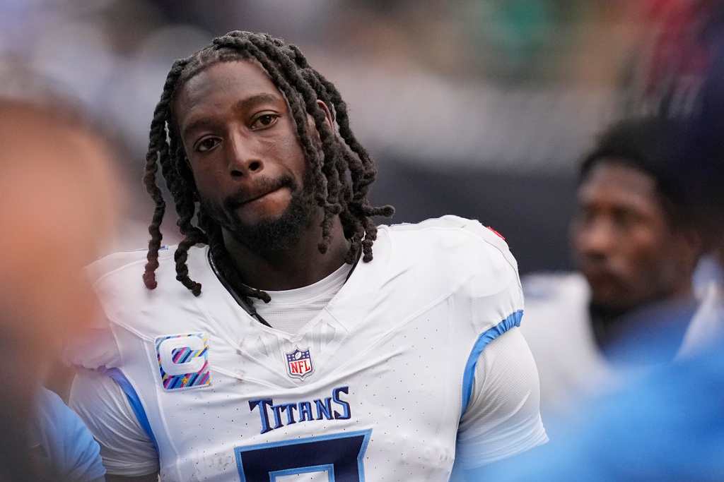 Tennessee Titans wide receiver Calvin Ridley walks the sideline during the second half of an NFL football game against the Houston Texans, Sunday, Sept. 28, 2025, in Houston. (AP Photo/David J. Phillip)