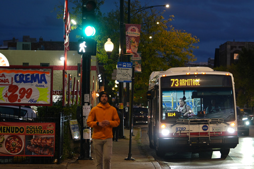 A bus drops a passenger off, across the street from Funston Elementary School in Chicago's Logan Square neighborhood, Tuesday, Oct. 14, 2025. (AP Photo/Rebecca Blackwell) A bus drops a passenger off, across the street from Funston Elementary School in Chicago's Logan Square neighborhood, Tuesday, Oct. 14, 2025. (AP Photo/Rebecca Blackwell)