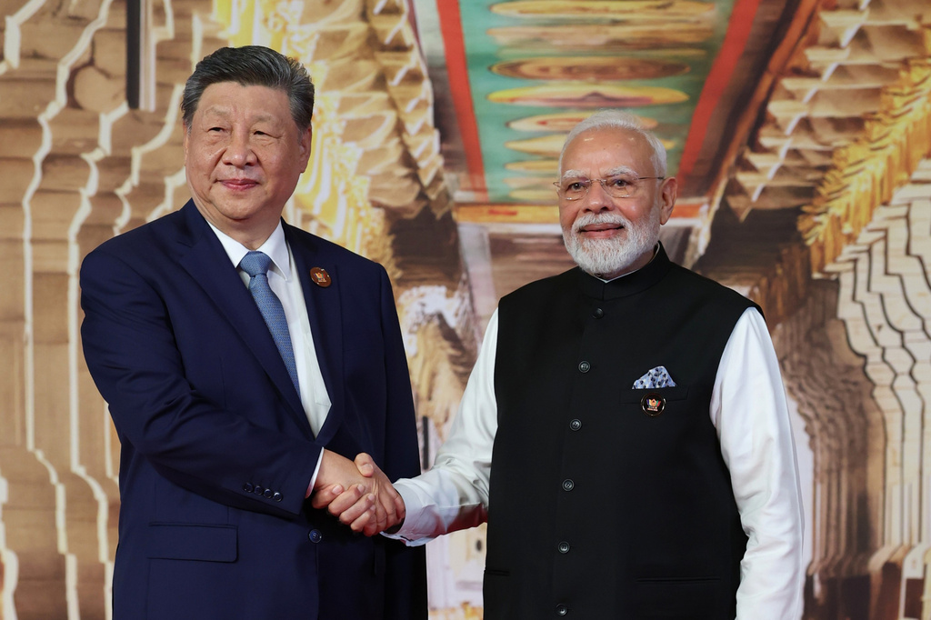 In this photo provided by the Indian Foreign Ministry, Indian Prime Minister Narendra Modi, right, greets Chinese President Xi Jinping upon his arrival for the BRICS summit in New Delhi, India, Saturday, Sept. 12, 2026. (Indian Foreign Ministry via AP)