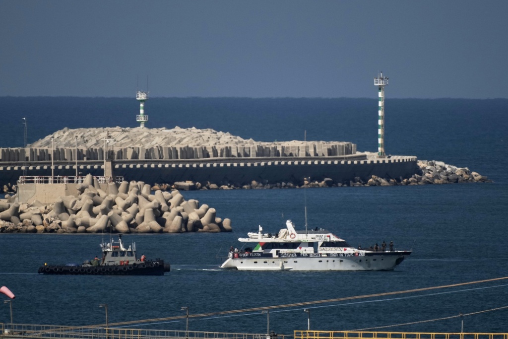 A Gaza-bound Sumud flotilla boat is escorted into the port of Ashdod, Israel, Thursday, Oct. 2, 2025, after being intercepted while approaching the Gaza coast by Israeli navy soldiers. (AP Photo/Leo Correa)