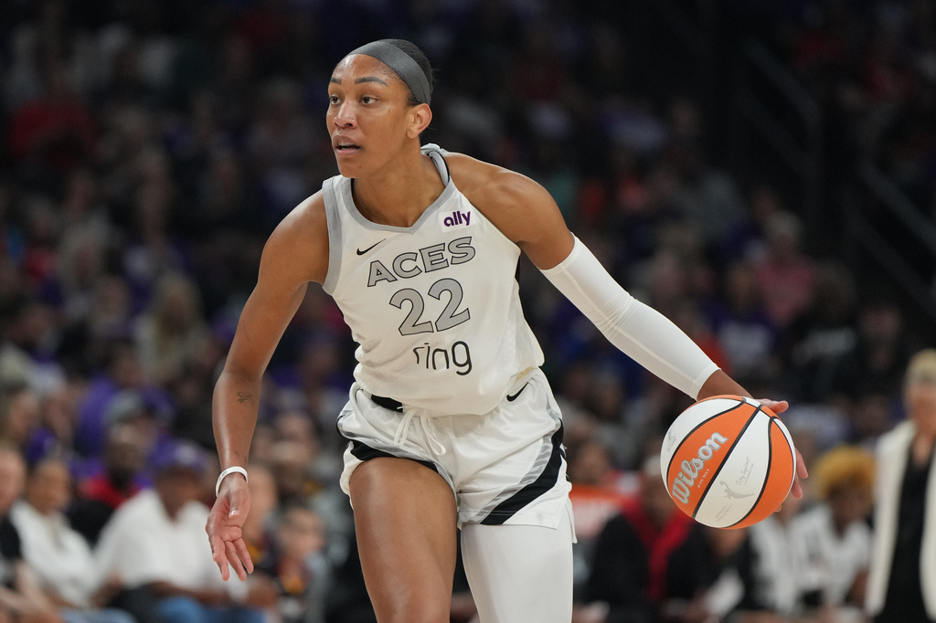 FILE - Las Vegas Aces center A'ja Wilson (22) dribbles against the Phoenix Mercury during the first half of Game 4 of the WNBA basketball finals, Friday, Oct. 10, 2025, in Phoenix. (AP Photo/Rick Scuteri, File)