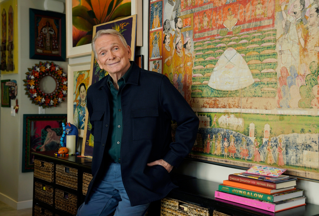 FILE - Costume and fashion designer Bob Mackie poses at his home in Palm Springs, Calif., on Oct. 20, 2021. (AP Photo/Chris Pizzello, File)