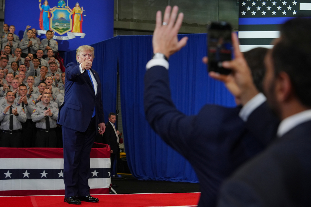 President Donald Trump departs as FBI Director Kash Patel, right, watches at the David Mack Center for Training and Intelligence, Friday, Aug. 14, 2026, in Garden City, N.Y. (AP Photo/Julia Demaree Nikhinson)