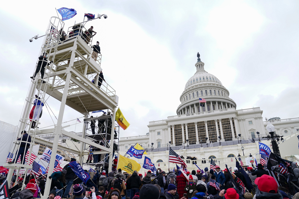 FILE - Trump supporters gather outside the Capitol, Jan. 6, 2021, in Washington. (AP Photo/John Minchillo, File)