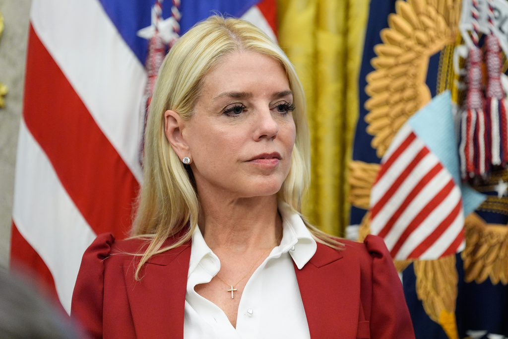 Attorney General Pam Bondi listens as President Donald Trump speaks after signing an executive order regarding TikTok in the Oval Office at the White House, Thursday, Sept. 25, 2025, in Washington. (AP Photo/Alex Brandon)