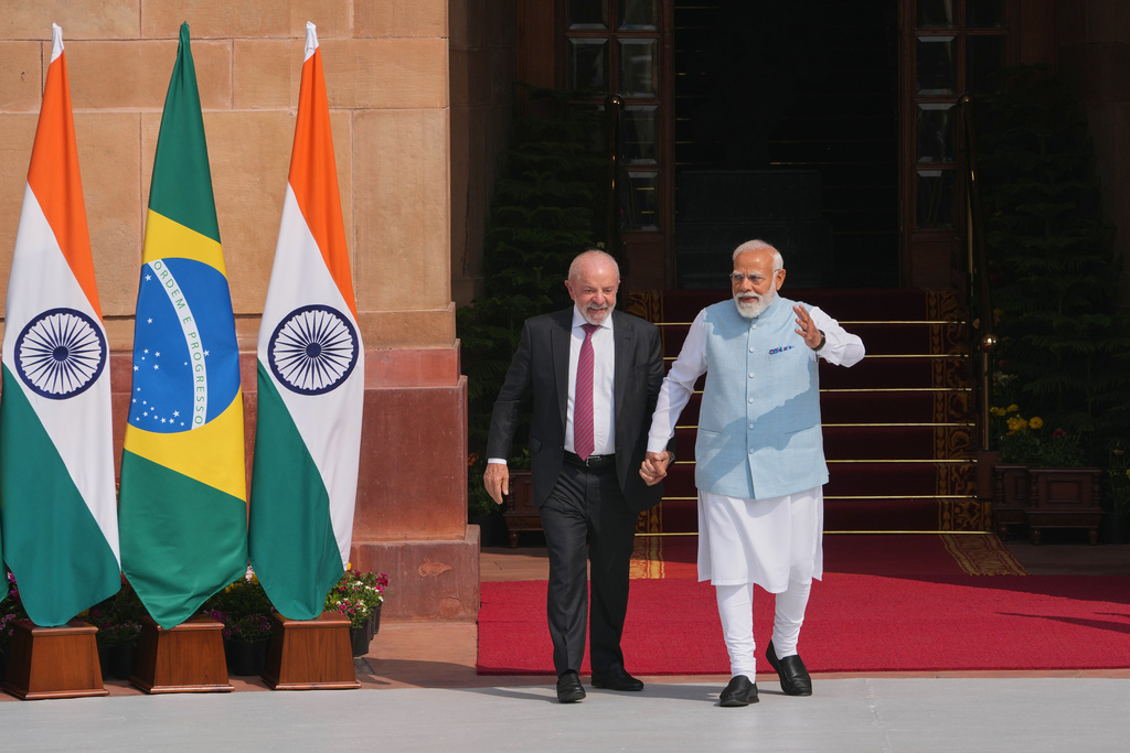 Indian Prime Minister Narendra Modi, right, walks with Brazilian President Luiz Inacio Lula da Silva for a photo call before their delegation level meeting in New Delhi, India, Saturday, Feb. 21, 2026. (AP Photo/Manish Swarup)