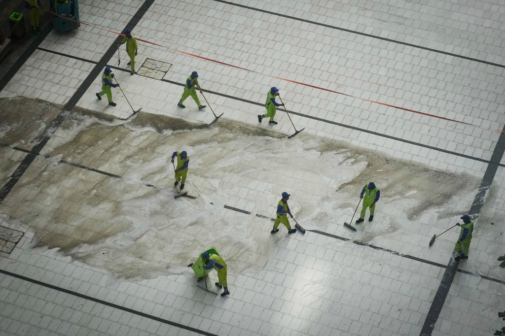 Workers clean a street outside the Grand Mosque during the annual Hajj pilgrimage in the Muslim holy city of Mecca, Saudi Arabia, Friday, May 22, 2026. (AP Photo/Altaf Qadri)