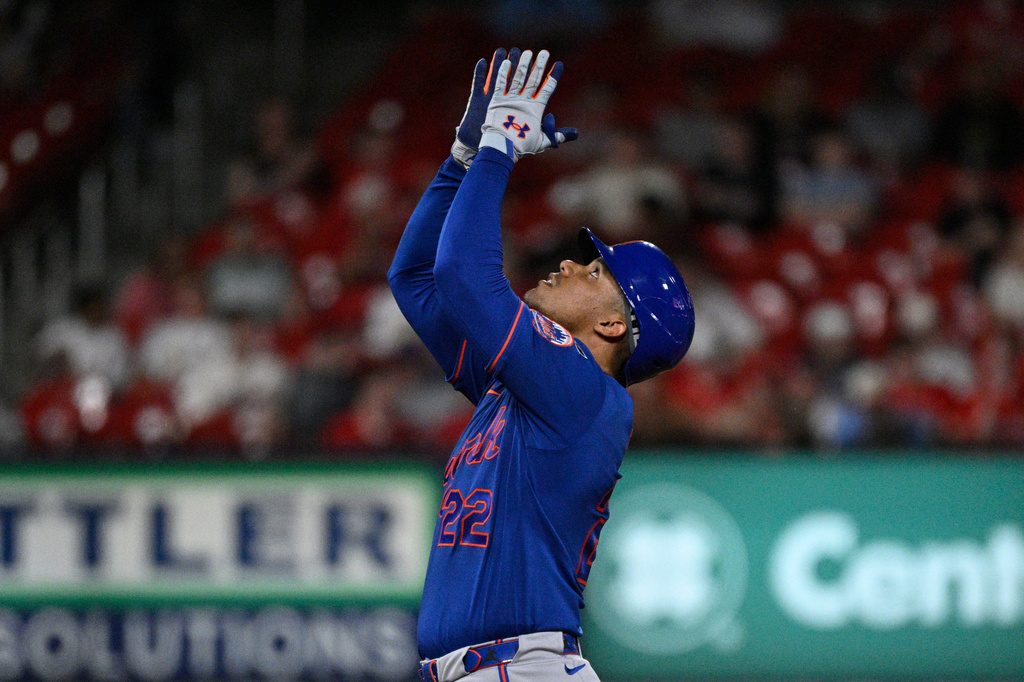 New York Mets' Juan Soto (22) celebrates after hitting a double in the sixth inning of a baseball game against the St. Louis Cardinals, Tuesday, March 31, 2026, in St. Louis. (AP Photo/Joe Puetz)