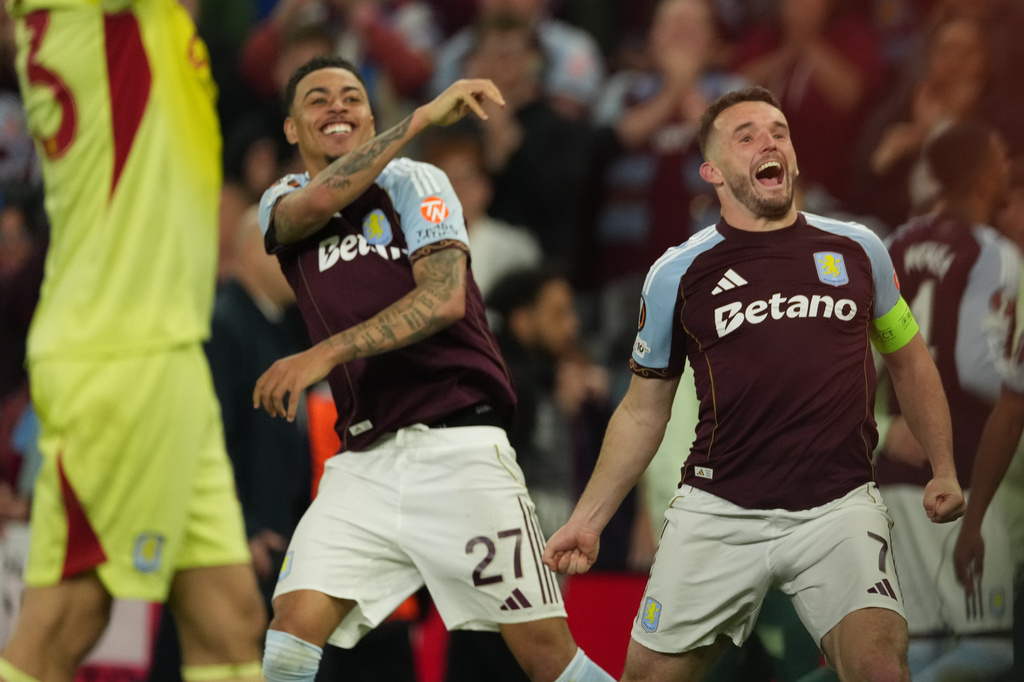 Aston Villa's John McGinn, right, and Morgan Rogers react after the Europa League second-leg semifinal soccer match between Aston Villa and Nottingham Forest in Birmingham, England, Thursday, May 7, 2026. (AP Photo/Dave Shopland)
