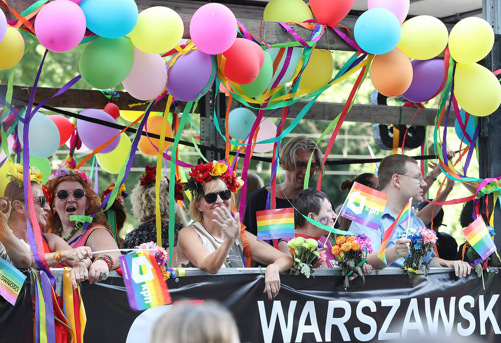 FILE - People take part in the Gay Pride parade in Warsaw, Poland, June 9, 2018. (AP Photo/Czarek Sokolowski, file)