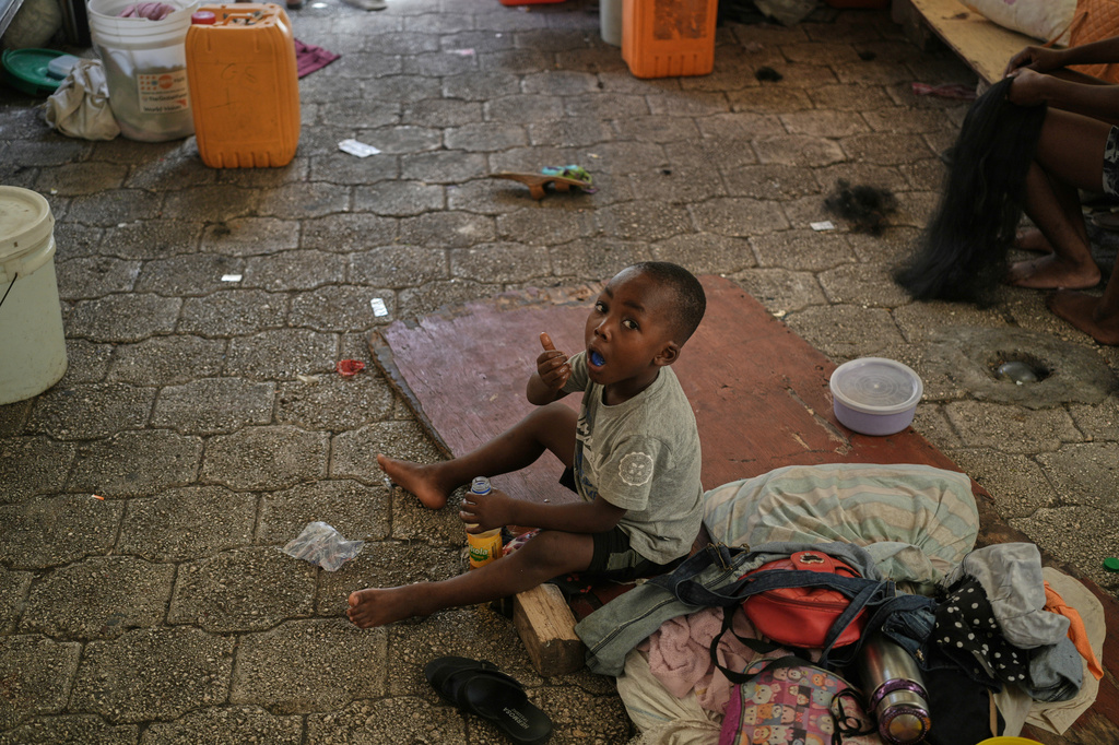 A boy plays at a shelter for families displaced by gang violence in Port-au-Prince, Haiti, Monday, Aug. 17, 2026. (AP Photo/Odelyn Joseph)