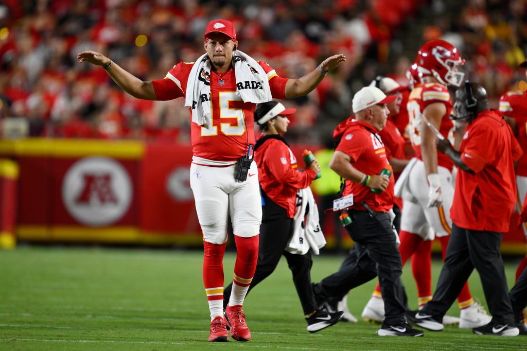 Kansas City Chiefs quarterback Patrick Mahomes (15) motions to teammates during the second half of a preseason NFL football game against the Seattle Seahawks, Friday, Aug. 28, 2026, in Kansas City, Mo. (AP Photo/Reed Hoffmann)