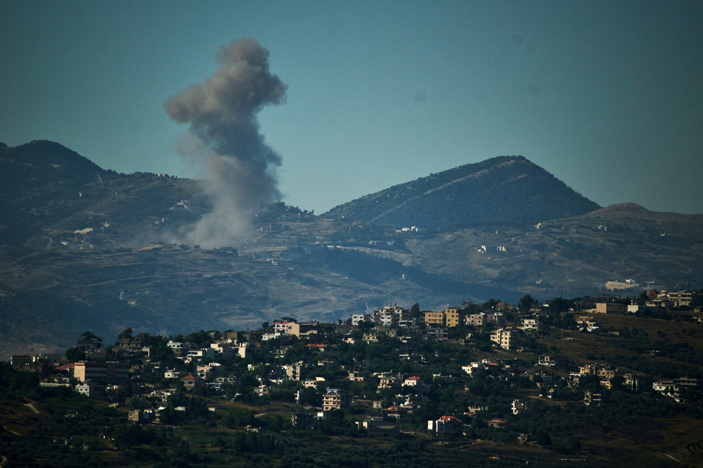 Smoke rises to the sky following an Israeli military strike in southern Lebanon as seen from northern Israel, Friday, June 19, 2026. (AP Photo/Leo Correa)