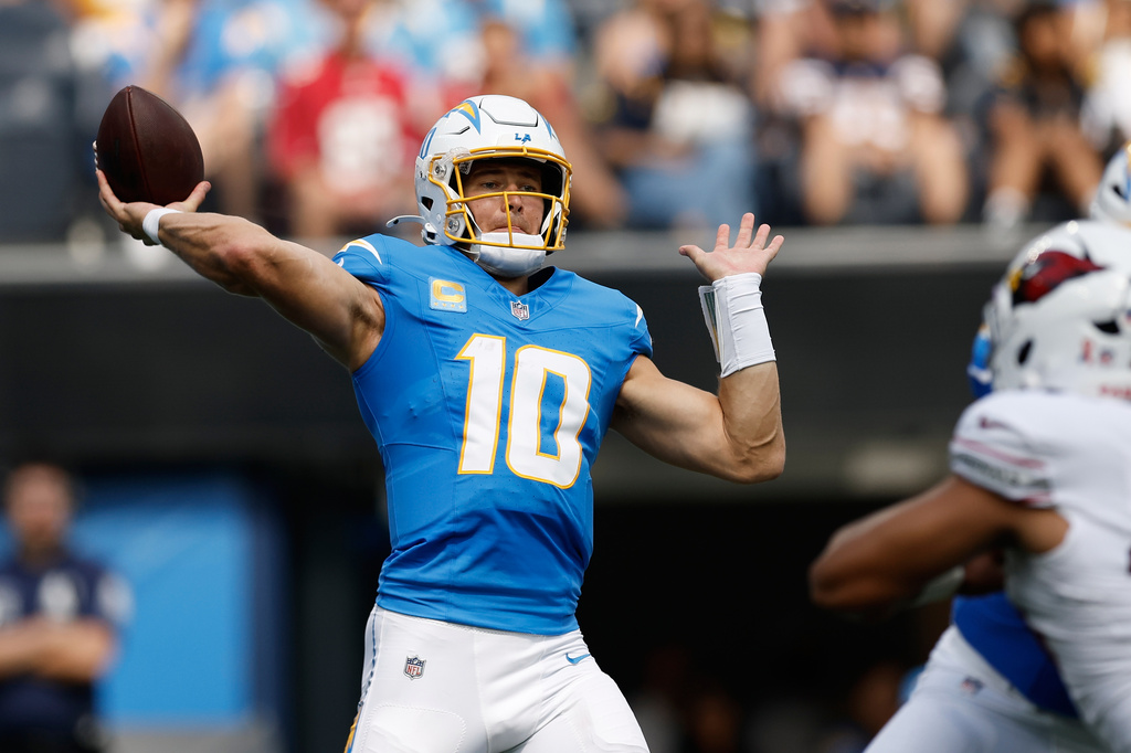 Los Angeles Chargers quarterback Justin Herbert (10) passes against the Arizona Cardinals during the first half of an NFL football game, Sunday, Sept. 13, 2026, in Inglewood, Calif. (AP Photo/Caroline Brehman)