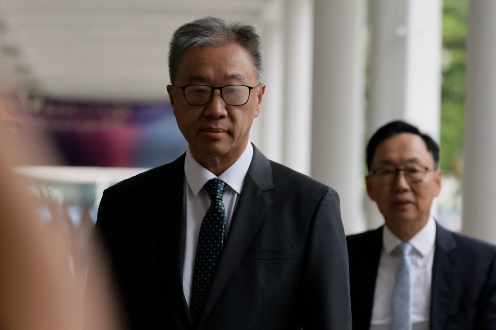 David Lok, chairman of the Independent Committee, arrives for the closing submissions at the Independent Commission investigation hearing into last year's Tai Po deadly fire, in Hong Kong, Friday, July 17, 2026. (AP Photo/May James)