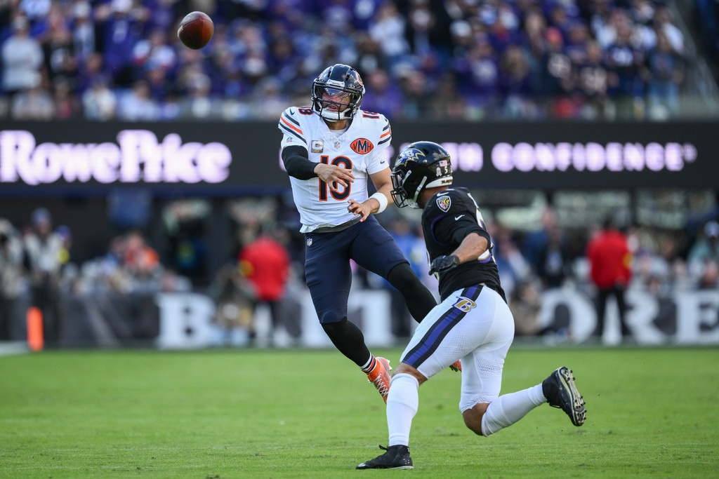Chicago Bears quarterback Caleb Williams (18) passes over Baltimore Ravens linebacker Kyle Van Noy (53) during the second half an NFL football game, Sunday, Oct. 26, 2025, in Baltimore. (AP Photo/Nick Wass)