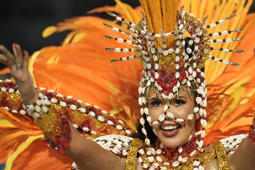 A performer from the Grande Rio samba school parades during Carnival celebrations at the Sambadrome, in Rio de Janeiro, Wednesday, Feb. 18, 2026. (AP Photo/Silvia Izquierdo)