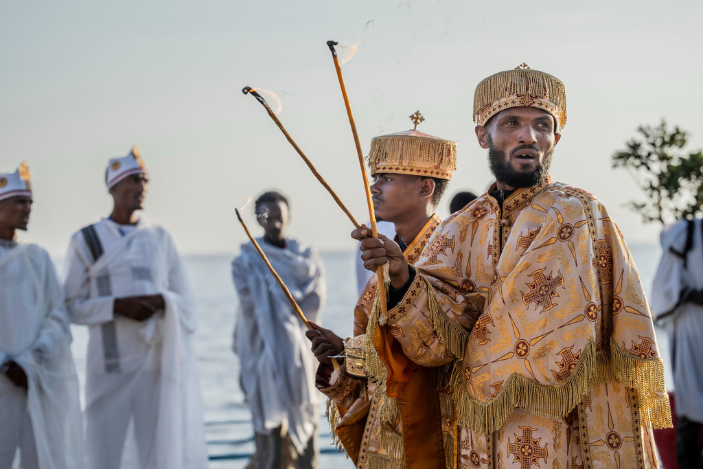 Orthodox worshipers celebrate Timket, the Ethiopian Epiphany, on lake Dembel, in Batu, Ethiopia, Monday, Jan. 19, 2026. (AP Photo/Amanuel Sileshi)
