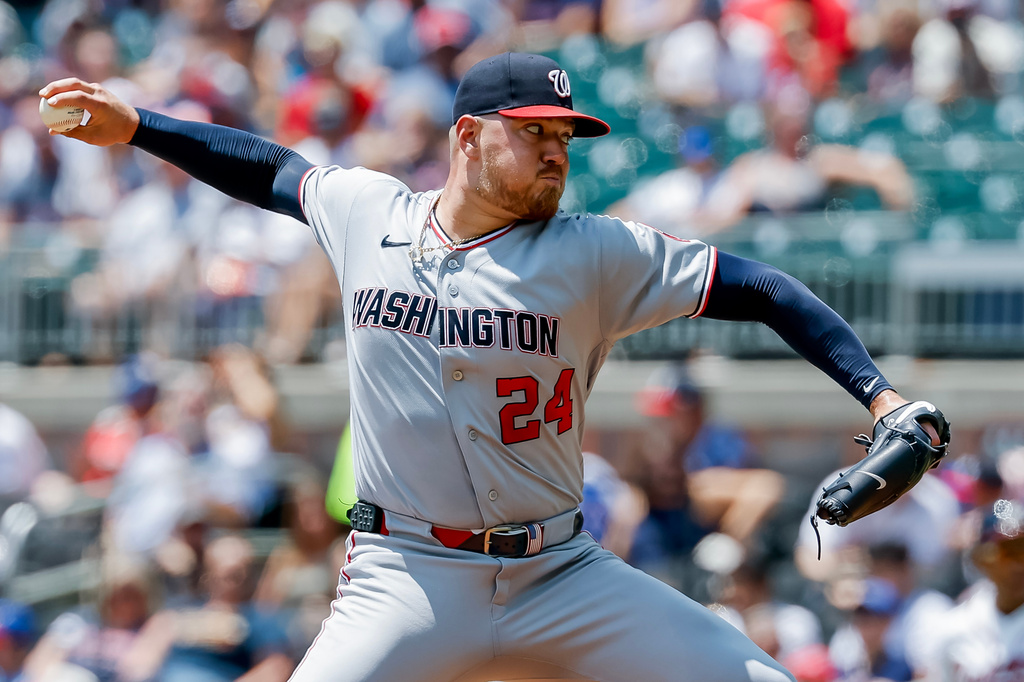 Washington Nationals pitcher Cade Cavalli delivers to an Atlanta Braves batter during the first inning of a baseball game, Sunday, Aug. 2, 2026, in Atlanta. (AP Photo/Erik S. Lesser)