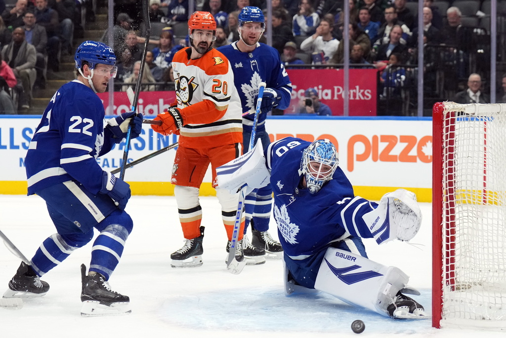 Toronto Maple Leafs goaltender Joseph Woll (60) is scored on as Jake McCabe (22), Brandon Carlo (25) and Anaheim Ducks Chris Kreider (20) watch during first period NHL hockey action in Toronto on Thursday, March 12, 2026. (Nathan Denette/The Canadian Press via AP)
