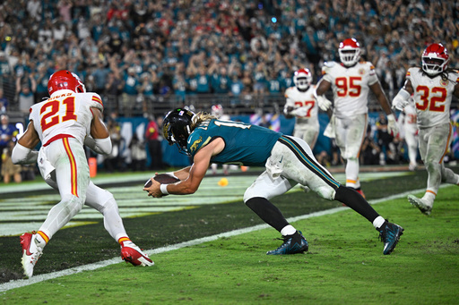 Jacksonville Jaguars quarterback Trevor Lawrence (16) dives into the end zone to score a touchdown during the second half of an NFL football game against the Kansas City Chiefs, Monday, Oct. 6, 2025, in Jacksonville, Fla. (AP Photo/Phelan M. Ebenhack) Jacksonville Jaguars quarterback Trevor Lawrence (16) dives into the end zone to score a touchdown during the second half of an NFL football game against the Kansas City Chiefs, Monday, Oct. 6, 2025, in Jacksonville, Fla. (AP Photo/Phelan M. Ebenhack)