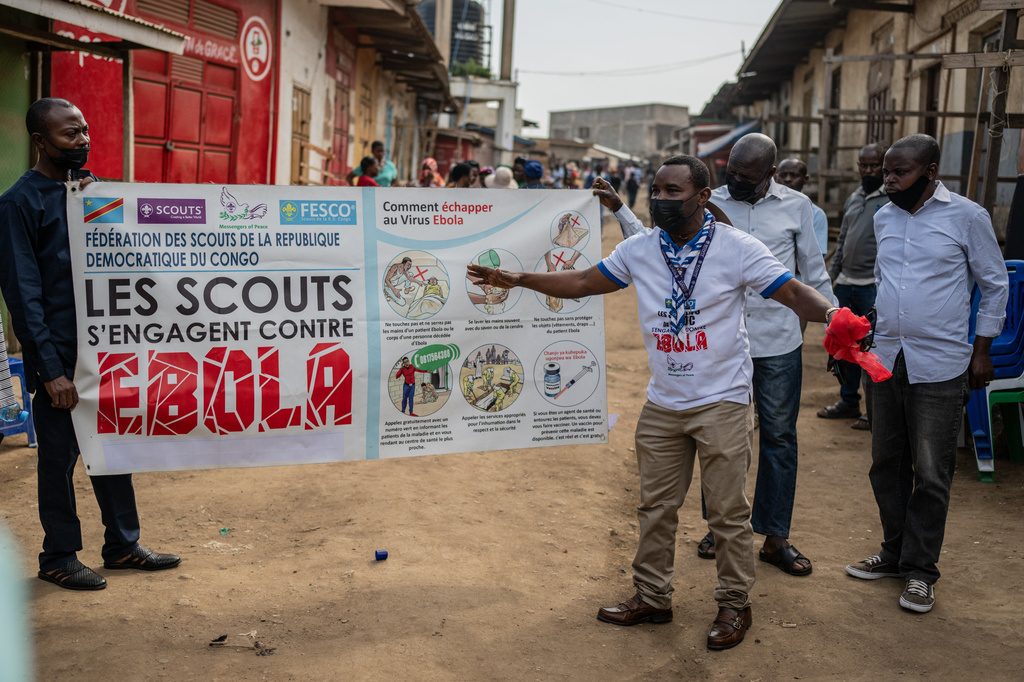 Members of the Congo Scouts movement carry an Ebola awareness banner along a street during a public sensitisation campaign amid the Ebola outbreak in Bunia, Congo, Saturday, May 23, 2026. (AP Photo/Moses Sawasawa)