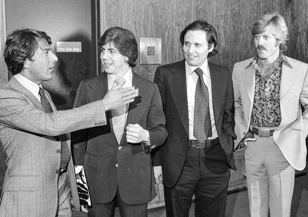 FILE - Washington Post reporters Carl Bernstein, second left, and Bob Woodward, second right, are flanked by actors Dustin Hoffman, left, and Robert Redford as they attend the premiere of "All the President's Men," in Washington, on April 5, 1976. (AP Photo, File)