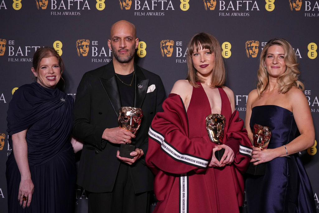 Lauren Frankfort Meltzer, from left, Matt Houghton, Georgie Wileman, and Harriette Wright pose with the award for British short film for 'This Is Endometriosis' at the 79th British Academy Film Awards, BAFTA's, in London, Sunday, Feb. 22, 2026. (AP Photo/Alastair Grant)