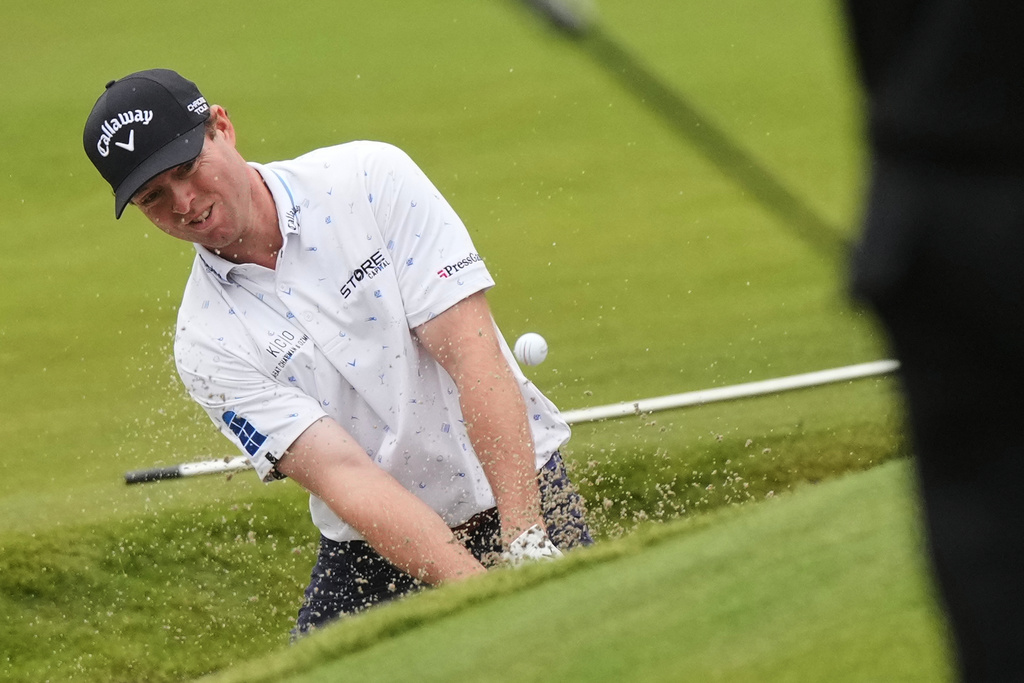 Max Greyserman, of the U.S., hits out of the bunker on the 16th hole during the third round of the Baycurrent Classic golf tournament at the Yokohama Country Club in Yokohama, near Tokyo, Saturday, Oct. 11, 2025. (AP Photo/Hiro Komae)