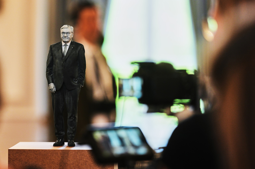 Media cover the sculpture "Bundespraesident Frank-Walter Steinmier 1:5" during the press preview of an exhibition of contemporary art at the German President's residency, Bellevue Palace, in Berlin, Germany, Monday, June 8, 2026. (AP Photo/Markus Schreiber)