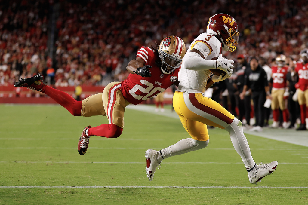 Washington Commanders wide receiver Stefon Diggs (3) scores past San Francisco 49ers cornerback Upton Stout (20) during the second half of an NFL football game in Santa Clara, Calif., Monday, Oct. 19, 2026. (AP Photo/Kelley L. Cox)