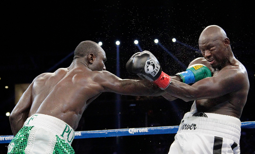 FILE - Antonio Tarver, right, takes a punch from Lateef Kayode, of Nigeria, during a boxing match in Carson, Calif., June 2, 2012. (AP Photo/Jae C. Hong, File)