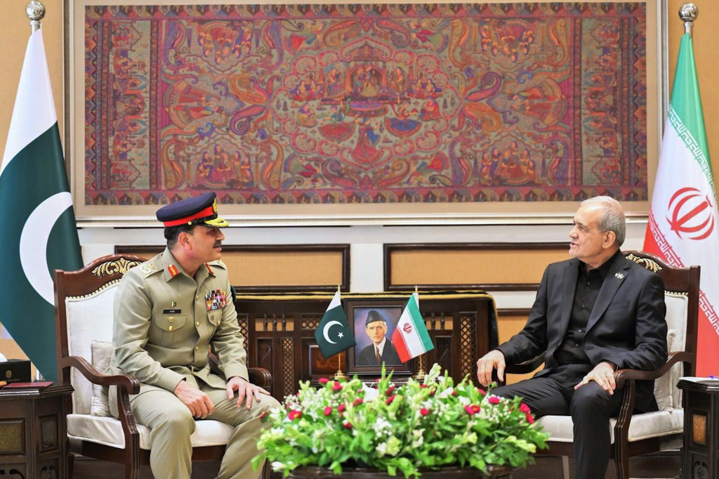 In this photo released by the Inter Services Public Relations, Iran's President Masoud Pezeshkian, right, meets with Pakistan Army Chief Field Marshal Asim Munir, in Islamabad, Pakistan, on Tuesday, June 23, 2026. (Inter Services Public Relations via AP)