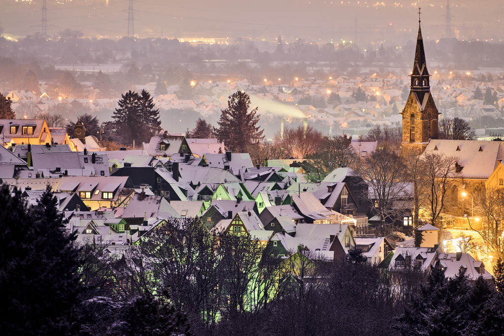 Freshly fallen snow lies on the roofs of houses in Kronberg near Frankfurt, Germany, early Tuesday, Jan. 6, 2026. (AP Photo/Michael Probst)