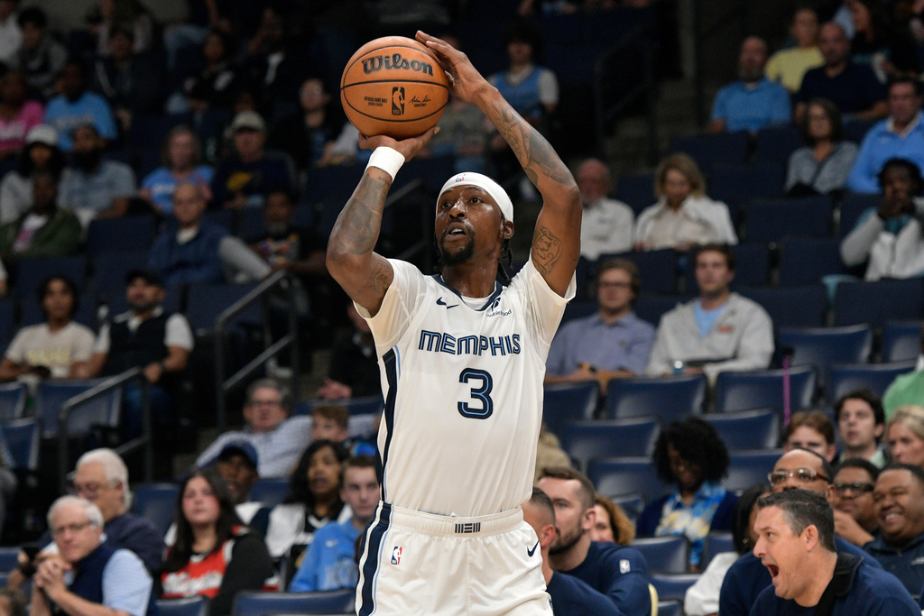 Memphis Grizzlies guard Kentavious Caldwell-Pope shoots against the Detroit Pistons in the first half of an NBA basketball preseason game, Monday, Oct. 6, 2025, in Memphis, Tenn. (AP Photo/Brandon Dill)