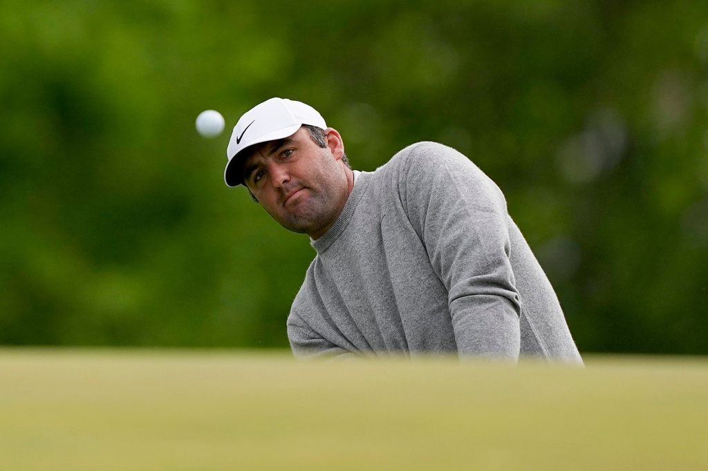 Scottie Scheffler chips onto the ninth green during the first round of the PGA Championship golf tournament at Aronimink Golf Club, Thursday, May 14, 2026, in Newtown Square, PA. (AP Photo/Carolyn Kaster)