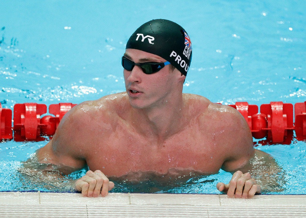 FILE - Britain's Ben Proud reacts after his performance in the men's 50-meter butterfly heat at the World Swimming Championships in Gwangju, South Korea, July 21, 2019. (AP Photo/Mark Schiefelbein, File)