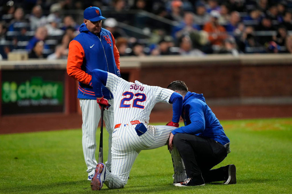 New York Mets designated hitter Juan Soto (22) reacts after getting hit by the ball on his ankle during the third inning of a baseball game against the Detroit Tigers, Wednesday, May 13, 2026, in New York. (AP Photo/Yuki Iwamura)
