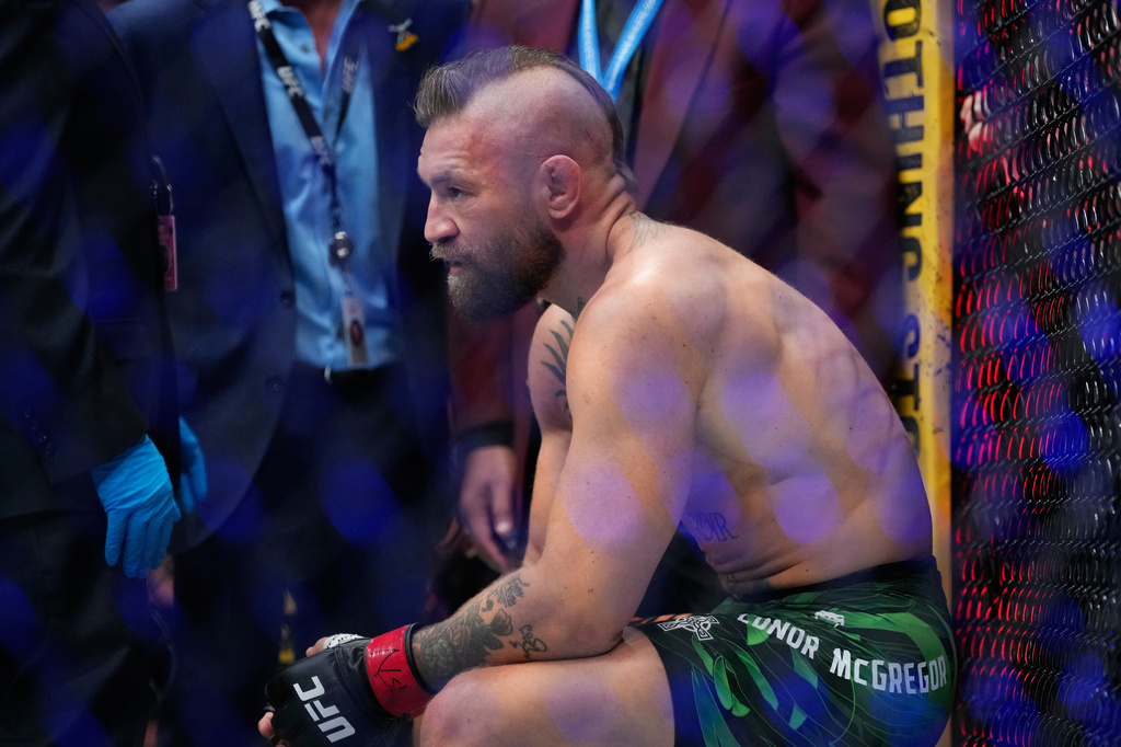 Conor McGregor reacts after losing to Max Holloway in a welterweight fight at the UFC 329 mixed martial arts event Saturday, July 11, 2026, in Las Vegas. (AP Photo/John Locher)
