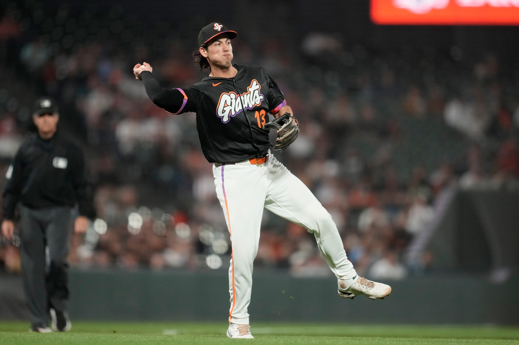 San Francisco Giants third baseman Shay Whitcomb throws out St. Louis Cardinals' Masyn Winn at first base during the seventh inning of a baseball game, Tuesday, Sept. 8, 2026, in San Francisco. (AP Photo/Jeff Chiu)